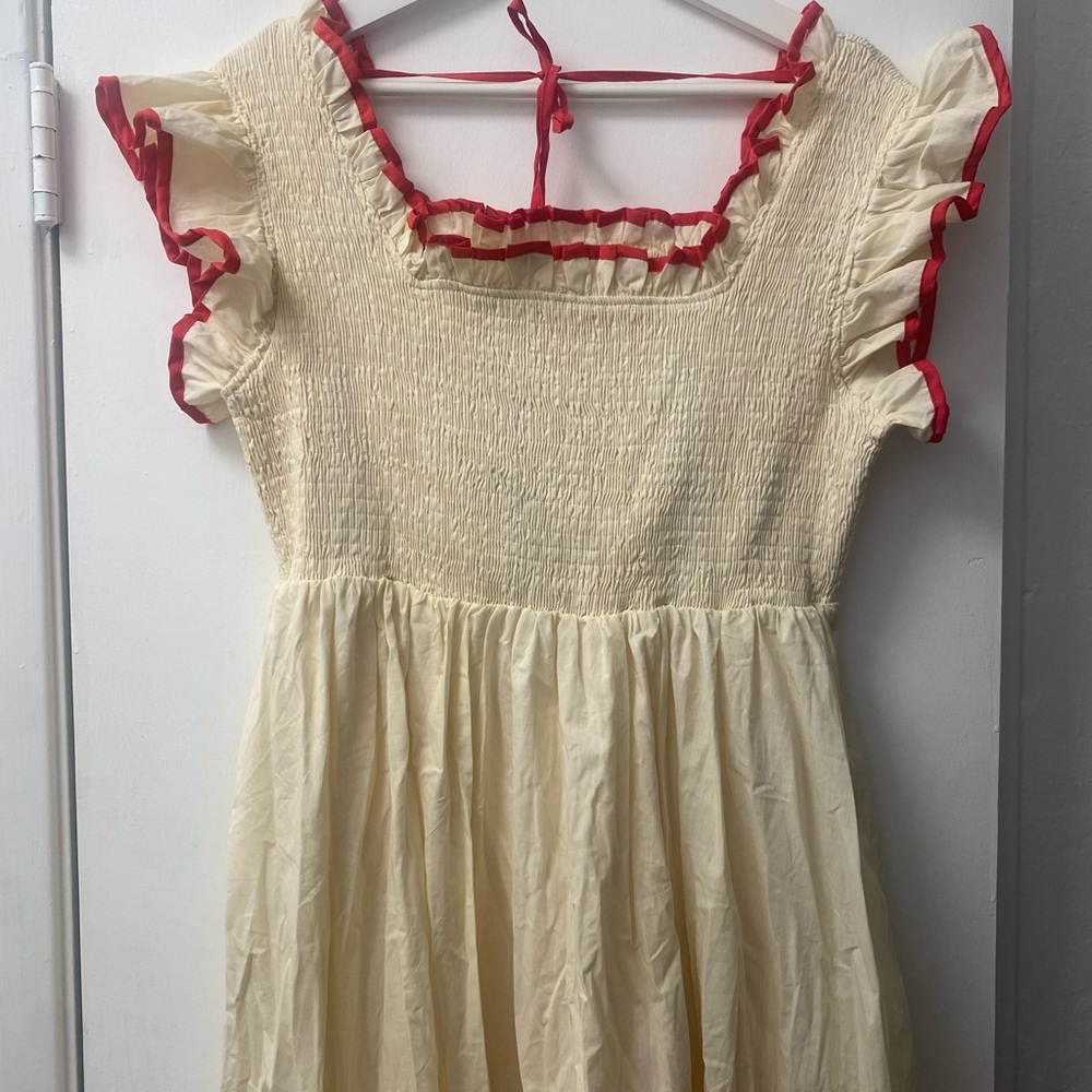 Elegant Cream Dress with Red Accents